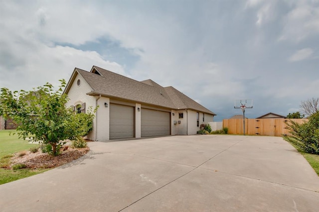 825 Silver Tree Dr, Choctaw, OK 73020 - view of front facade featuring a garage, driveway, roof with shingles, and brick siding