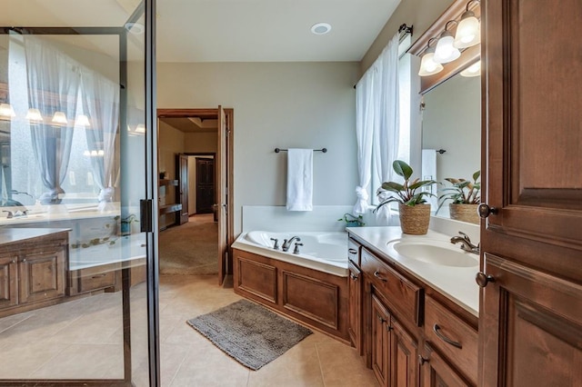 825 Silver Tree Dr, Choctaw, OK 73020 - bathroom featuring vanity, a garden tub, and tile patterned floors