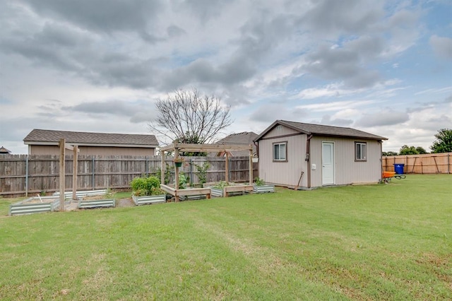 825 Silver Tree Dr, Choctaw, OK 73020 - fenced backyard with a vegetable garden and an outdoor structure