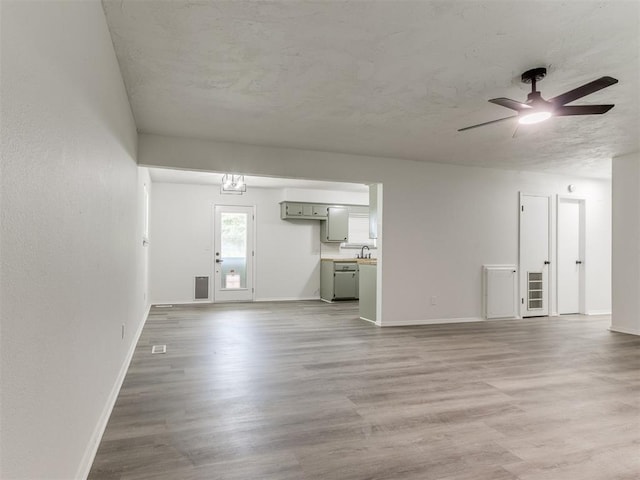 2550 Clarke St, Choctaw, OK 73020 - unfurnished living room with a ceiling fan and light wood-style floors