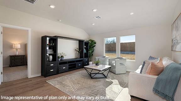 2608 Kathleens Xing, Yukon, OK 73099 - living area featuring lofted ceiling, wood finished floors, and recessed lighting