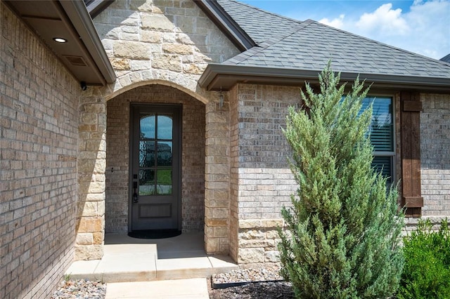 14704 Ashore Dr, Oklahoma City, OK 73142 - entrance to property featuring roof with shingles, brick siding, and stone siding