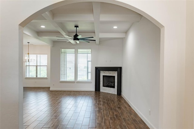 14704 Ashore Dr, Oklahoma City, OK 73142 - unfurnished living room featuring a ceiling fan, dark wood-type flooring, beam ceiling, coffered ceiling, and a fireplace