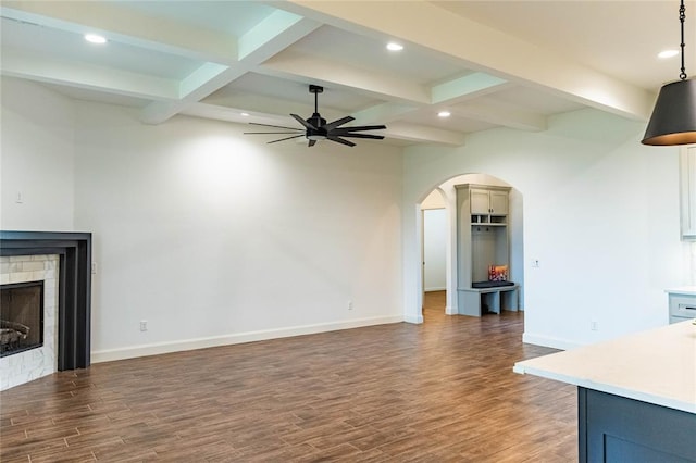 14704 Ashore Dr, Oklahoma City, OK 73142 - unfurnished living room with ceiling fan, wood finished floors, beam ceiling, recessed lighting, and a brick fireplace