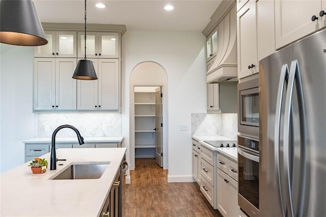 14704 Ashore Dr, Oklahoma City, OK 73142 - kitchen with appliances with stainless steel finishes, light countertops, recessed lighting, pendant lighting, and decorative backsplash