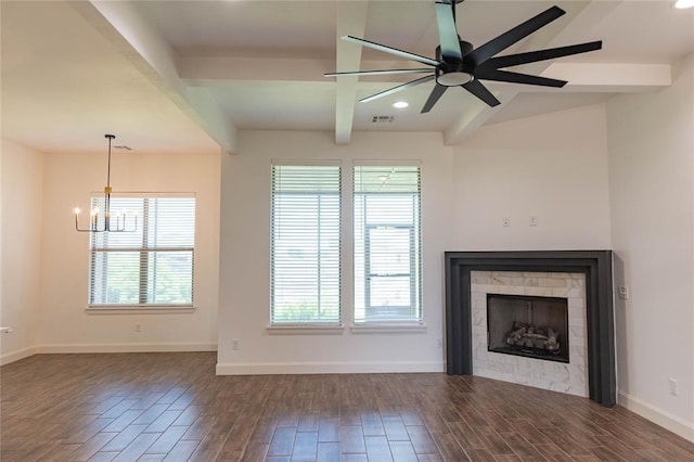 14704 Ashore Dr, Oklahoma City, OK 73142 - unfurnished living room featuring plenty of natural light, dark wood-style floors, beam ceiling, a chandelier, and a fireplace
