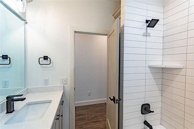 14704 Ashore Dr, Oklahoma City, OK 73142 - full bath featuring wood finished floors, vanity, and shower / tub combination