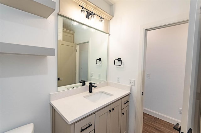 14704 Ashore Dr, Oklahoma City, OK 73142 - bathroom featuring vanity and wood finished floors