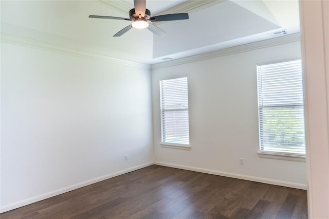 14704 Ashore Dr, Oklahoma City, OK 73142 - empty room with dark wood finished floors, crown molding, a ceiling fan, and a raised ceiling