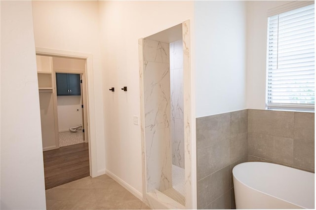 14704 Ashore Dr, Oklahoma City, OK 73142 - full bath featuring a soaking tub, a marble finish shower, and a walk in closet