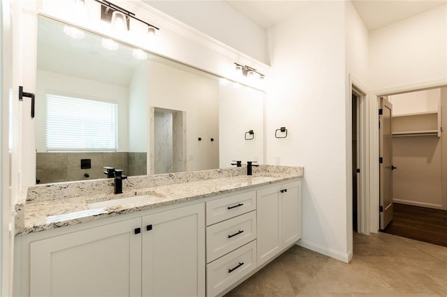 14704 Ashore Dr, Oklahoma City, OK 73142 - full bath featuring double vanity, a walk in shower, tile patterned flooring, and a walk in closet