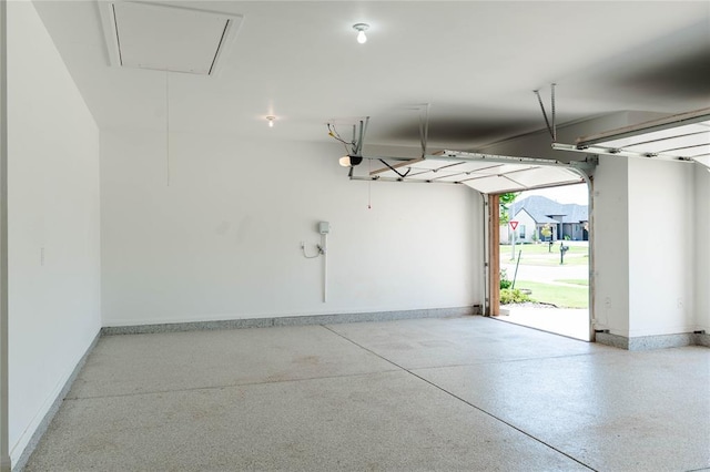14704 Ashore Dr, Oklahoma City, OK 73142 - garage with baseboards and a garage door opener