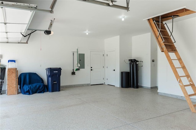 14704 Ashore Dr, Oklahoma City, OK 73142 - garage featuring electric panel and a garage door opener