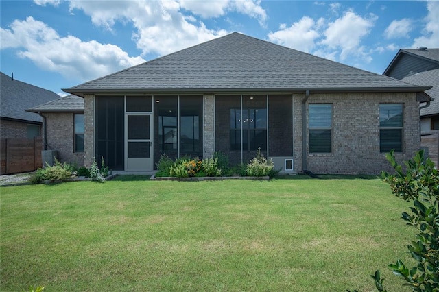 14704 Ashore Dr, Oklahoma City, OK 73142 - rear view of property with brick siding, roof with shingles, and a sunroom