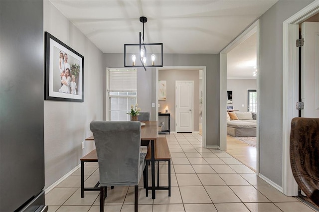 4155 NW Terrace Hills Rd, Piedmont, OK 73078 - dining space with light tile patterned floors and a chandelier