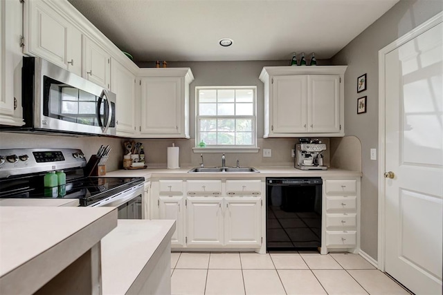 4155 NW Terrace Hills Rd, Piedmont, OK 73078 - kitchen with stainless steel appliances, light countertops, light tile patterned flooring, and white cabinetry