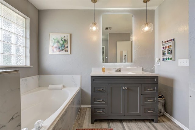 4155 NW Terrace Hills Rd, Piedmont, OK 73078 - bathroom with vanity, a bath, and wood finished floors