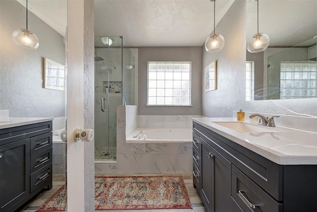 4155 NW Terrace Hills Rd, Piedmont, OK 73078 - bathroom with a textured wall, vanity, a stall shower, and a garden tub