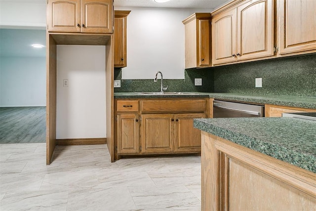 6609 SE 15th St, Oklahoma City, OK 73110 - kitchen with stainless steel dishwasher, dark countertops, decorative backsplash, and light marble finish flooring