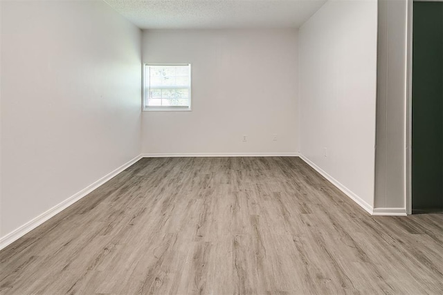 6609 SE 15th St, Oklahoma City, OK 73110 - unfurnished room featuring wood finished floors and a textured ceiling