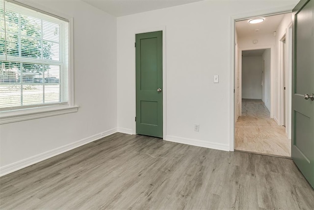 6609 SE 15th St, Oklahoma City, OK 73110 - unfurnished bedroom with light wood-type flooring and multiple windows