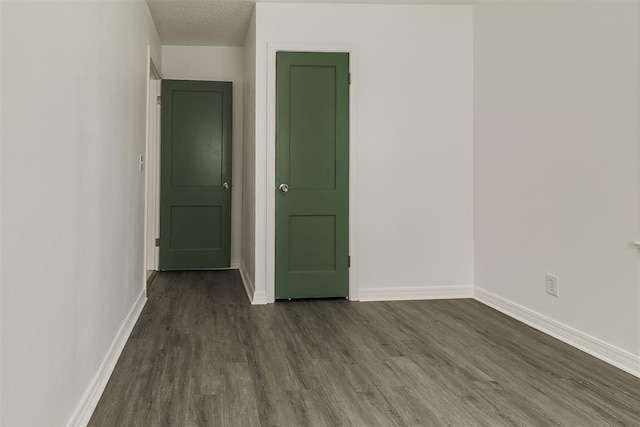 6609 SE 15th St, Oklahoma City, OK 73110 - unfurnished room featuring dark wood-type flooring and a textured ceiling