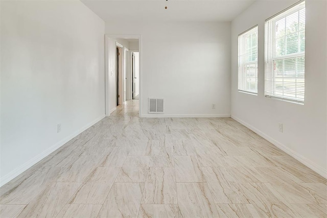 6609 SE 15th St, Oklahoma City, OK 73110 - unfurnished room with baseboards and marble look tiles