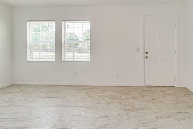 6609 SE 15th St, Oklahoma City, OK 73110 - empty room featuring light marble finish flooring