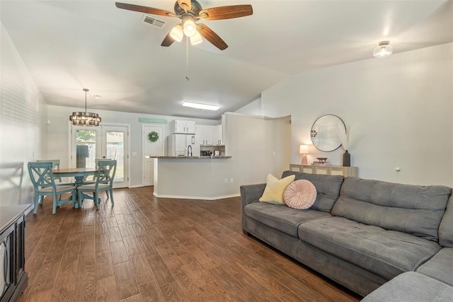 12281 SW 11th St, Yukon, OK 73099 - living area with vaulted ceiling, dark wood-style flooring, and ceiling fan