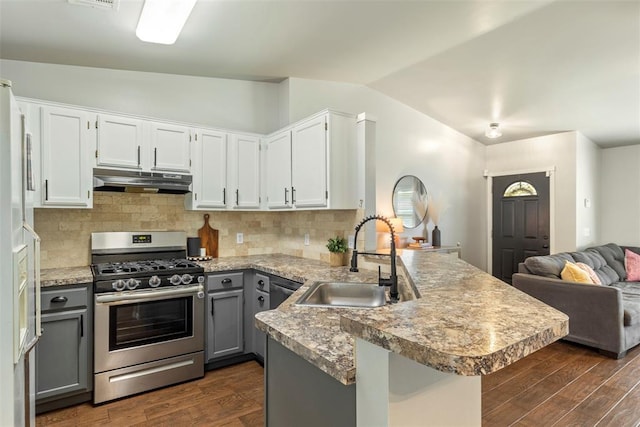 12281 SW 11th St, Yukon, OK 73099 - kitchen with gray cabinets, a peninsula, stainless steel gas range, open floor plan, and dark wood-type flooring