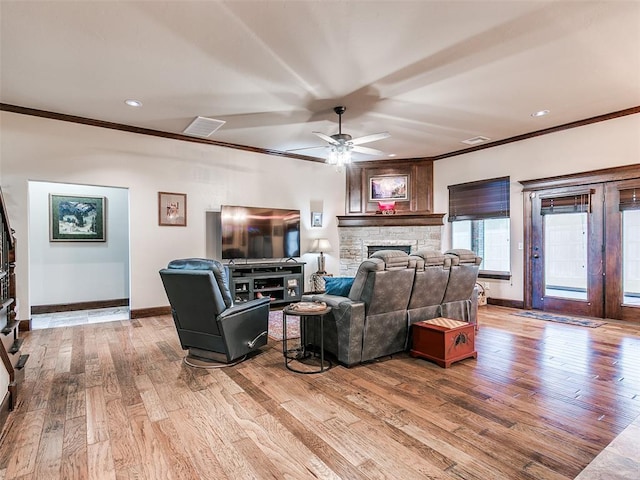 17401 Melville Ln, Edmond, OK 73012 - living room with ornamental molding, a fireplace, wood finished floors, ceiling fan, and recessed lighting