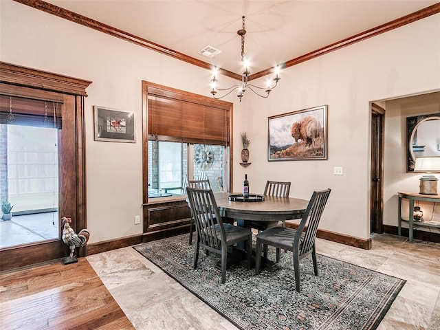 17401 Melville Ln, Edmond, OK 73012 - dining area with a chandelier and crown molding