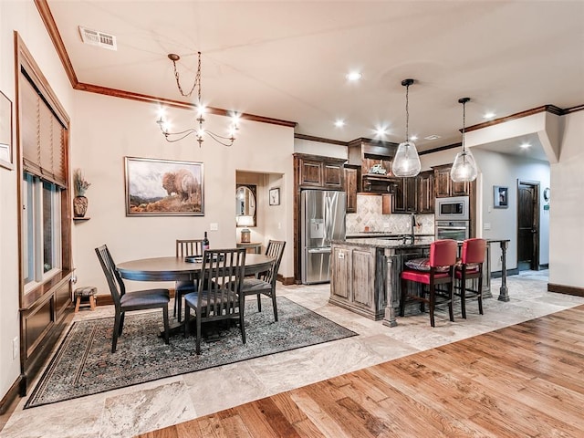 17401 Melville Ln, Edmond, OK 73012 - dining space featuring ornamental molding, a chandelier, and recessed lighting
