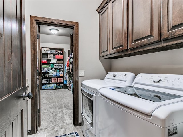 17401 Melville Ln, Edmond, OK 73012 - laundry room with separate washer and dryer, cabinet space, and light carpet