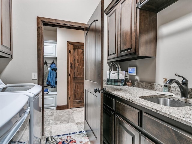 17401 Melville Ln, Edmond, OK 73012 - laundry room with cabinet space and washer and clothes dryer