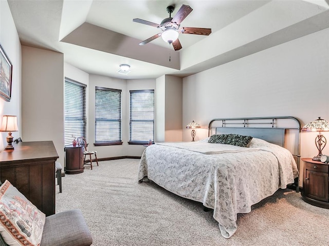 17401 Melville Ln, Edmond, OK 73012 - bedroom with carpet flooring, a raised ceiling, and a ceiling fan
