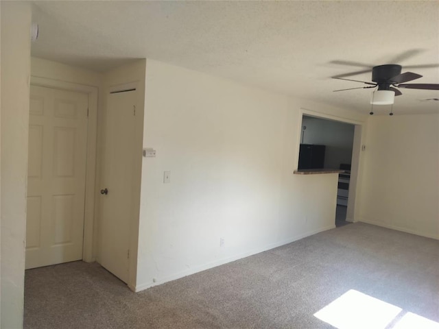 116 SE 39th St, Oklahoma City, OK 73129 - carpeted empty room with a ceiling fan and baseboards