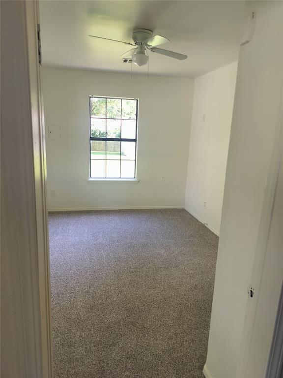 116 SE 39th St, Oklahoma City, OK 73129 - empty room featuring carpet flooring and ceiling fan