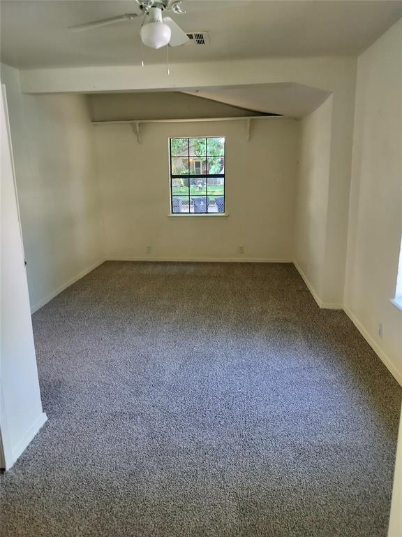 116 SE 39th St, Oklahoma City, OK 73129 - carpeted empty room with ceiling fan and baseboards