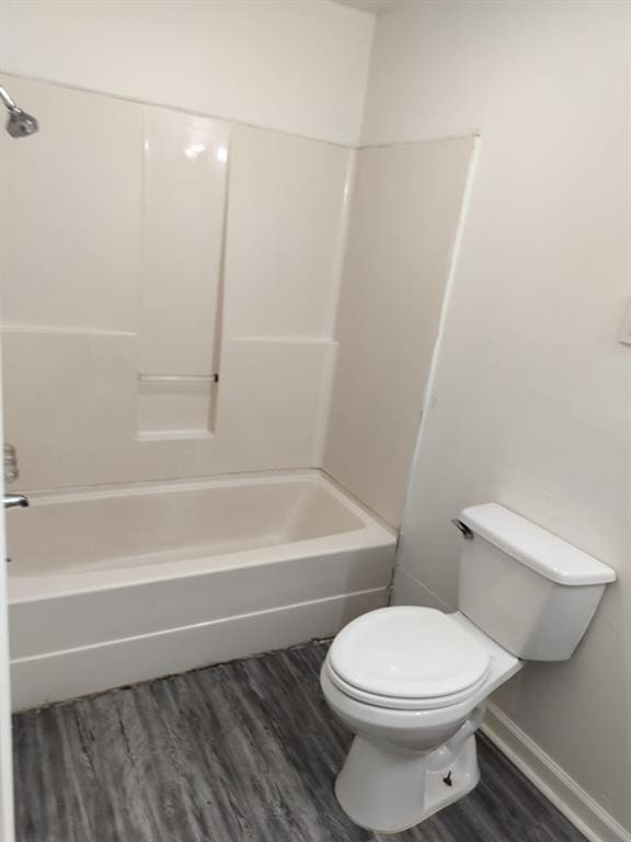 116 SE 39th St, Oklahoma City, OK 73129 - full bathroom with wood finished floors and washtub / shower combination