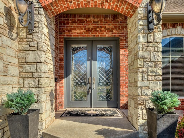 1217 Camelot Dr, Yukon, OK 73099 - property entrance featuring french doors and brick siding