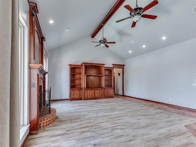 1217 Camelot Dr, Yukon, OK 73099 - unfurnished living room featuring high vaulted ceiling, ceiling fan, beam ceiling, a brick fireplace, and light wood-style flooring