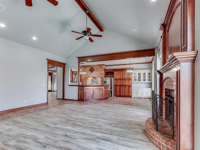 1217 Camelot Dr, Yukon, OK 73099 - unfurnished living room with ceiling fan, beam ceiling, a brick fireplace, light wood-style flooring, and recessed lighting