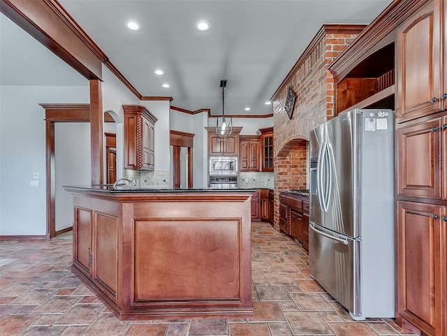 1217 Camelot Dr, Yukon, OK 73099 - kitchen with dark countertops, stainless steel appliances, stone tile floors, tasteful backsplash, and crown molding
