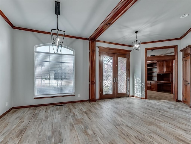 1217 Camelot Dr, Yukon, OK 73099 - foyer entrance featuring french doors, a chandelier, crown molding, and light wood-style floors