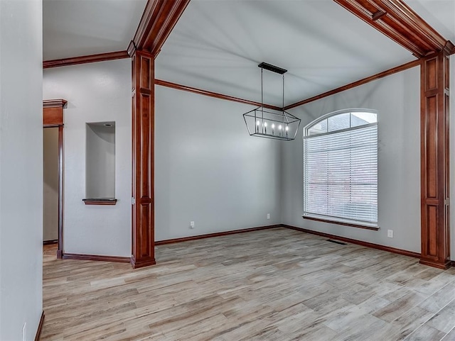 1217 Camelot Dr, Yukon, OK 73099 - empty room with a chandelier, ornamental molding, and light wood-type flooring