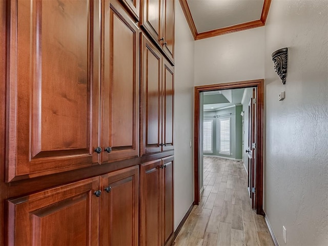 1217 Camelot Dr, Yukon, OK 73099 - hallway featuring crown molding and light wood finished floors