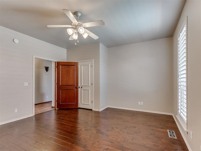 1217 Camelot Dr, Yukon, OK 73099 - unfurnished room with a ceiling fan and dark wood-type flooring