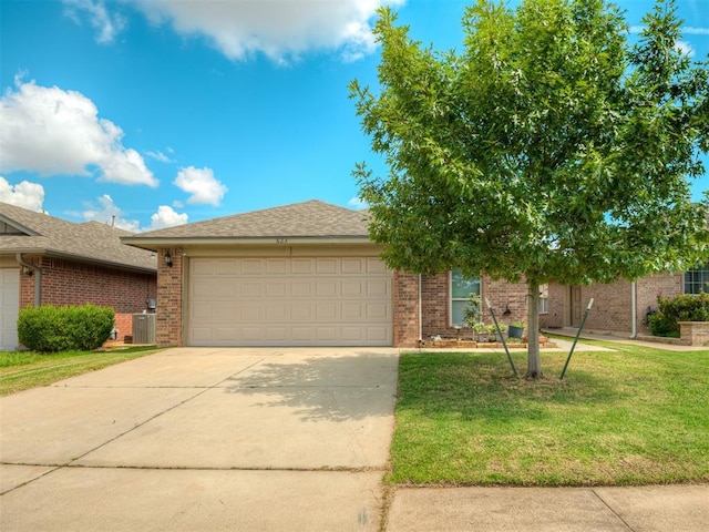 623 SW 37th St, Moore, OK 73160 - view of front of property featuring an attached garage, driveway, brick siding, and a front lawn