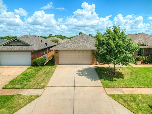 623 SW 37th St, Moore, OK 73160 - view of front of property with a shingled roof, brick siding, concrete driveway, and a front yard